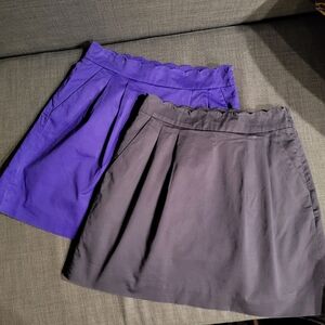 Two scalloped skirts with pockets